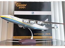 Detailed 1:200 scale model of the Antonov Airlines An-225 Mriya UR-82060 in the final yellow-and-blue livery.Operated from Ukraine the one AN-225 aircraft was being used to fly bulk supplies of medical supplies from China through the COVID-19 pandemic. The final operation was between 2 to 5 February 2022, collecting almost 90 tons of COVID-19 test kits from Tianjin, China and delivering the load to Billund, Denmark. The aircraft was at it's hanger at Antonov Airport, Hostomel for an engine swap when the airfield was targetted by Russian forces during their invasion of Ukraine. The An-225 was destroyed in the ensuing battle for control of the airfield.